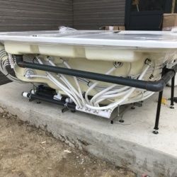 Installation d'un spa à débordement avec machinerie déportée dans les Alpes pour la Maison JACUZZI ®