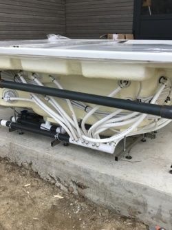 Installation d'un spa à débordement avec machinerie déportée dans les Alpes pour la Maison JACUZZI ®